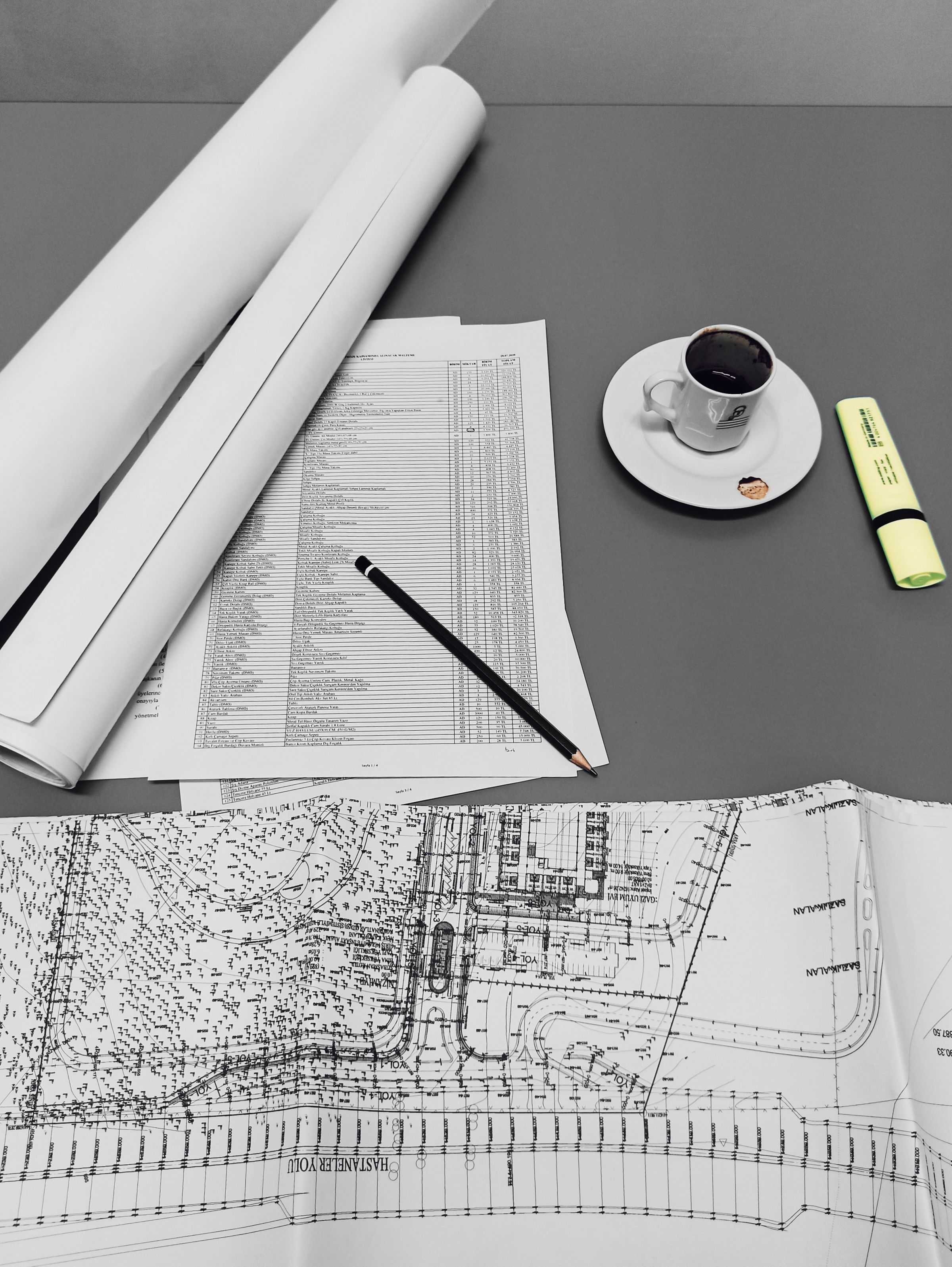 Construction drawings and schedules on a desk