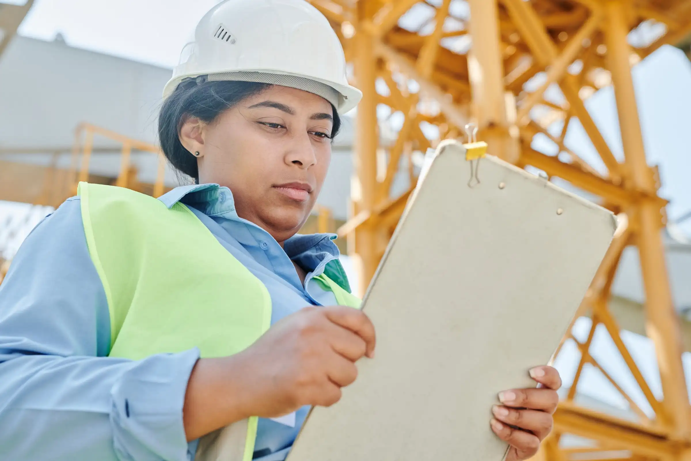 Engineer checking a quality checklist on site