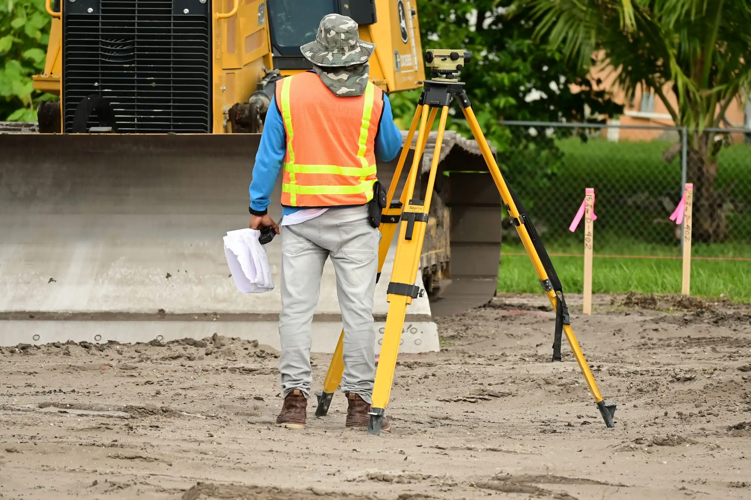 Surveyor setting out with a total station on site